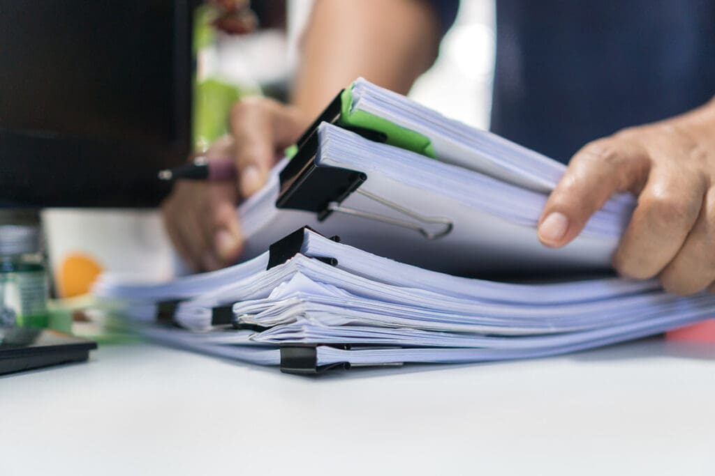 Man Grabs Production Scripts in Closeup