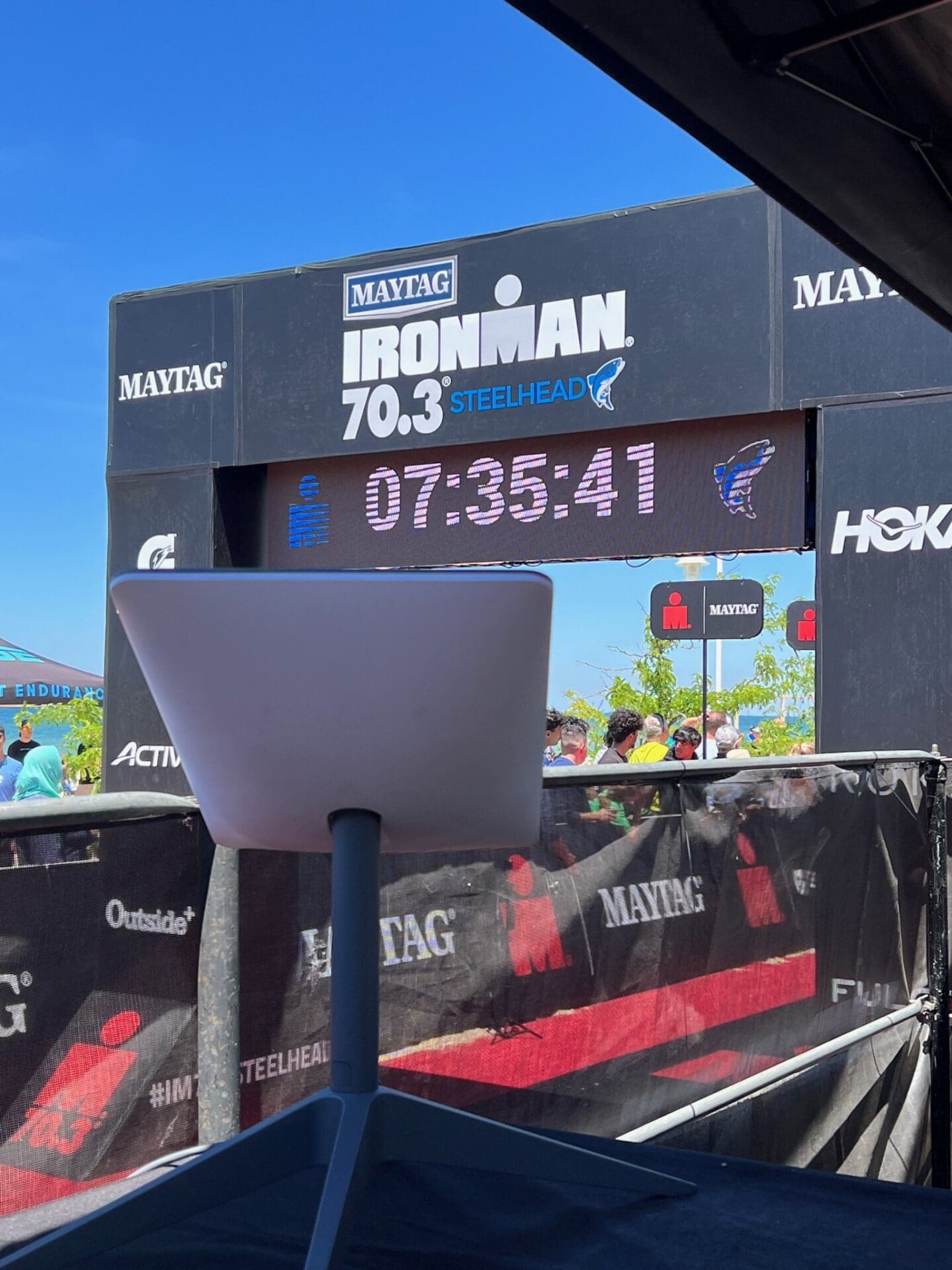 Finish line arch of IRONMAN 70.3 Steelhead with Starlink in the foreground