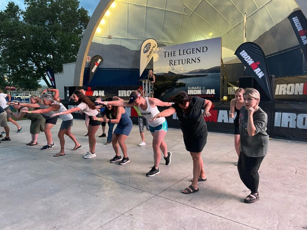 Audience members enthusiastically participate in a game, gathered in a lively atmosphere. 