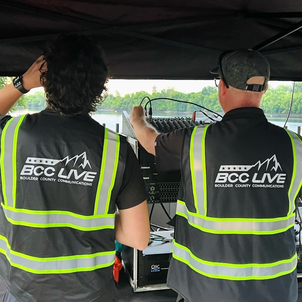 BCC Live in high-visibility vests working at an event