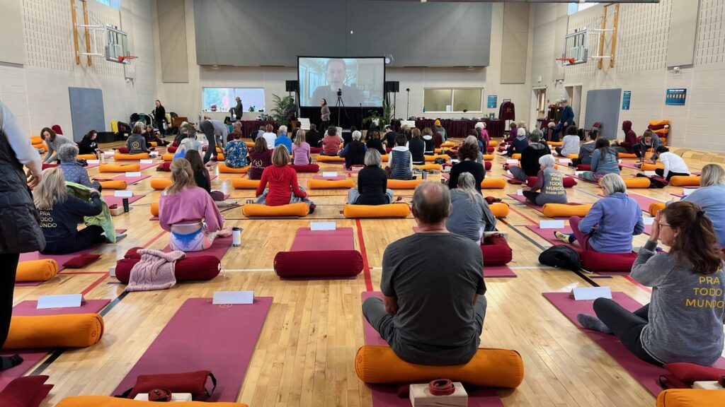 People practicing Yoga, watching their instructor teach virtually