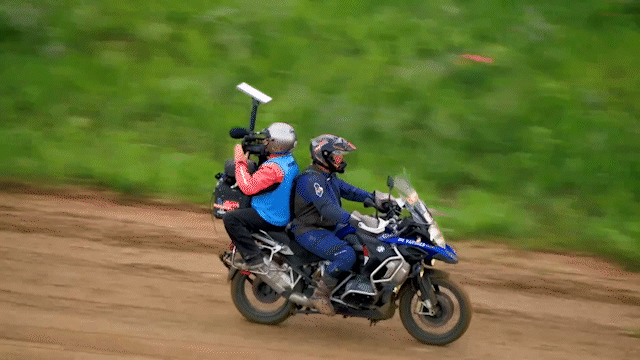 BCC Live camera operator and Media Moto driver do the robot live on the 2026 Life Time UNBOUND 200 Gravel broadcast.
